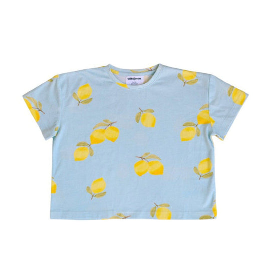 Light blue t-shirt with yellow lemon pattern on a white background