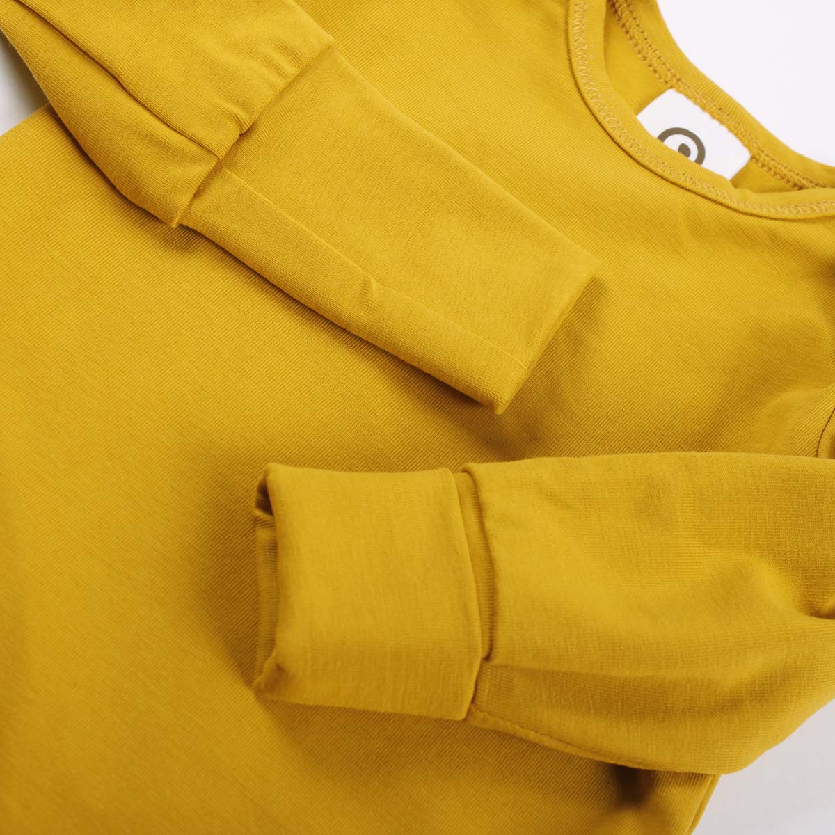 Cozy me mustard long sleeved bodysuit detail