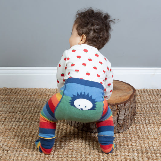 Baby wearing hedgehog stripy baby leggings