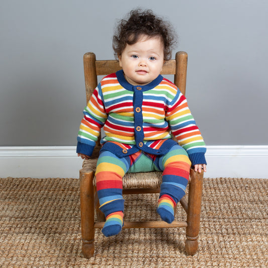 Baby wearing rainbow knit cardigan