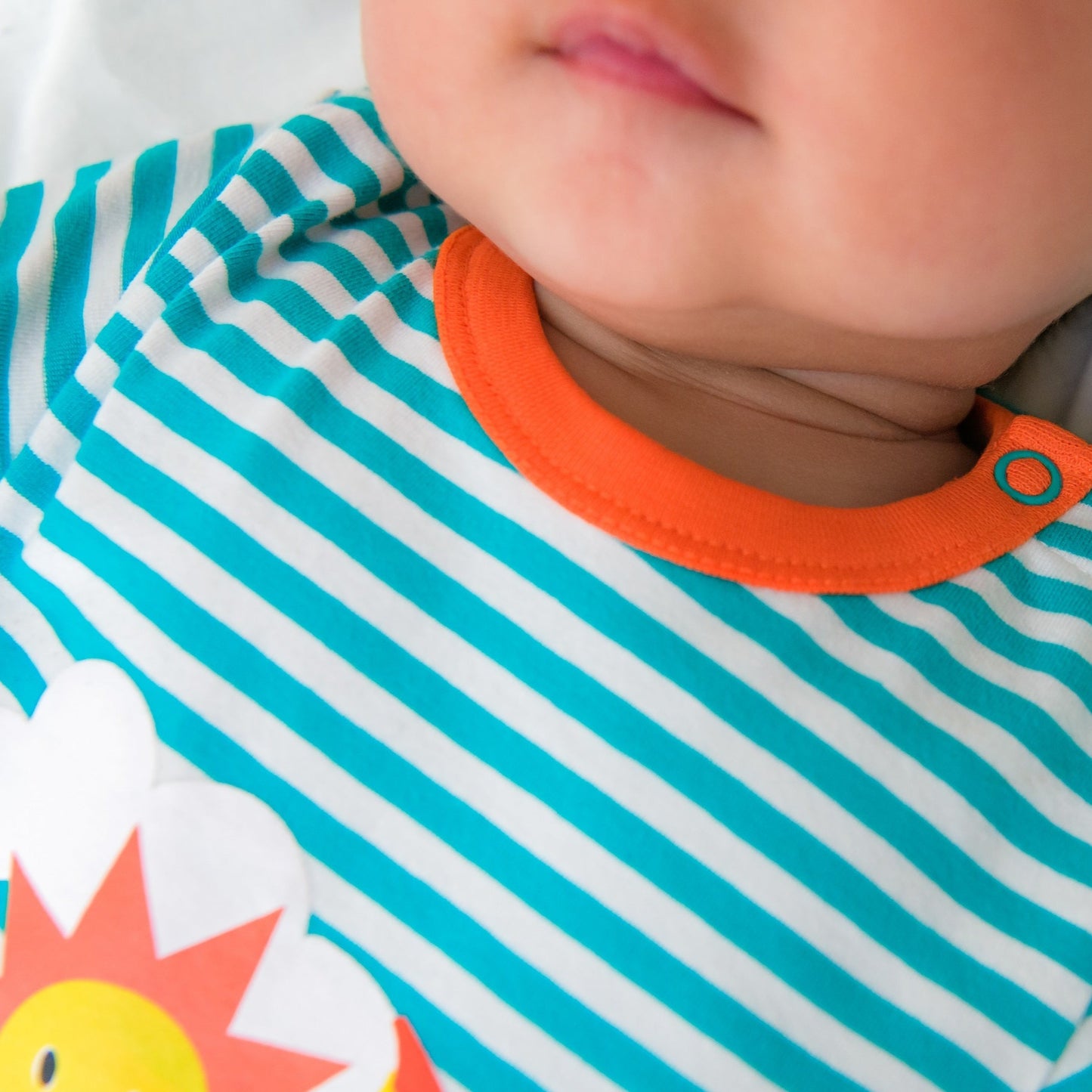 Organic Unisex Turquoise tripe bodysuit baby closeup