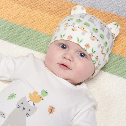 Baby wearing good life hat