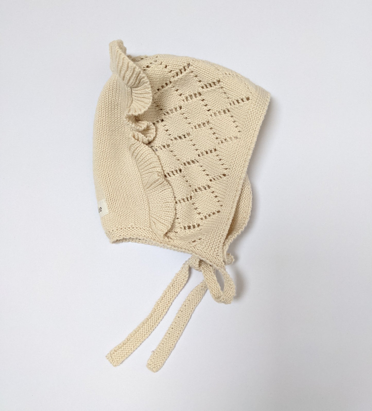 Cream knitted bonnet