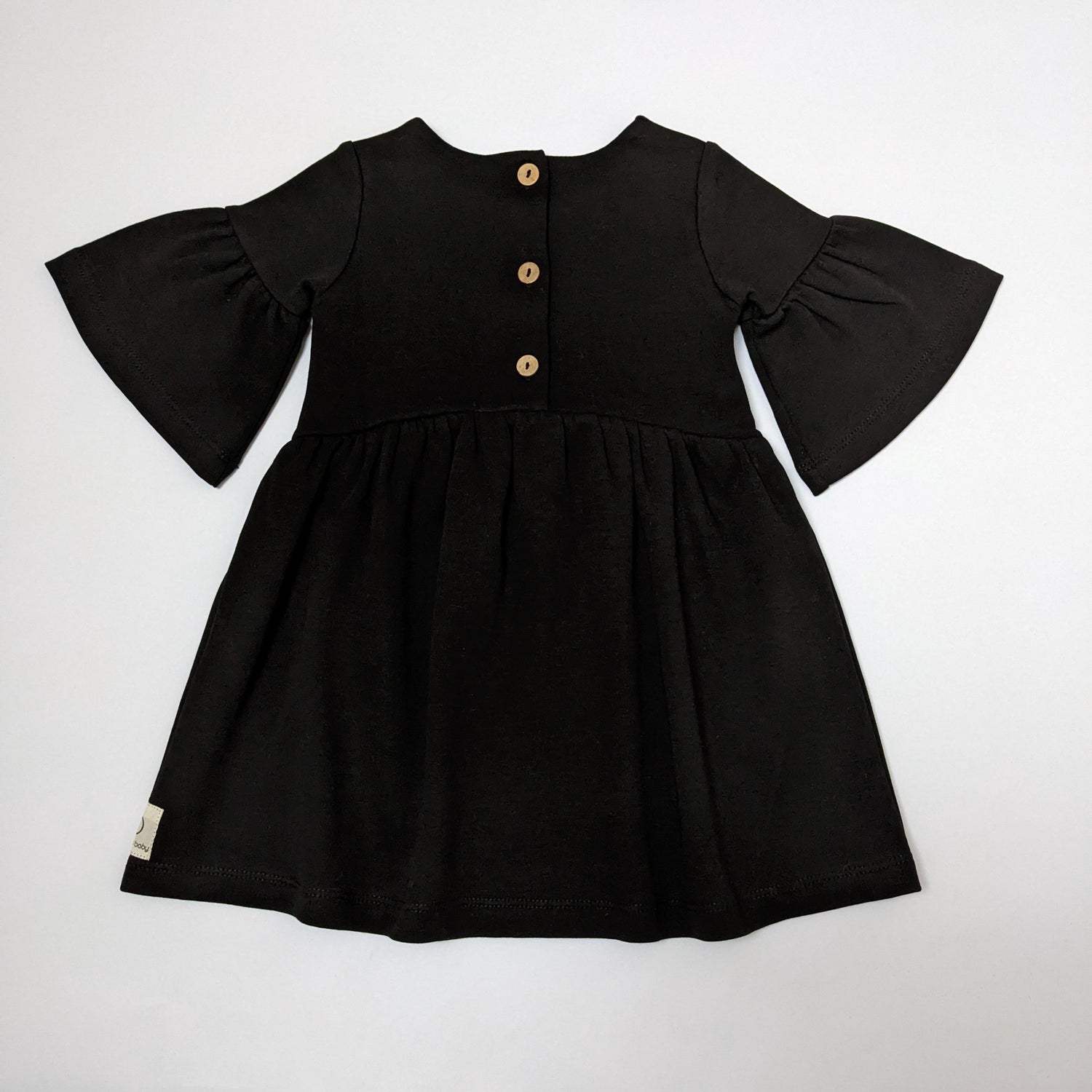 Back of black willow baby dress